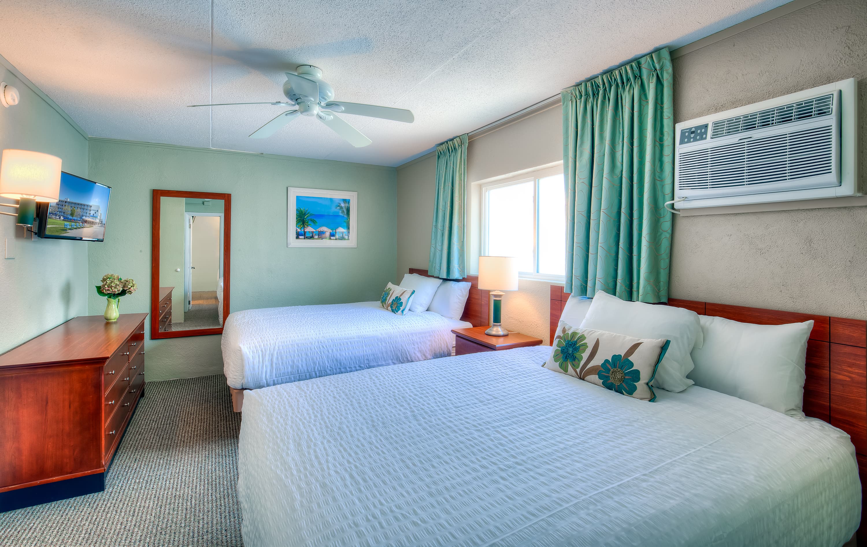 Bedroom #1 features two queen beds