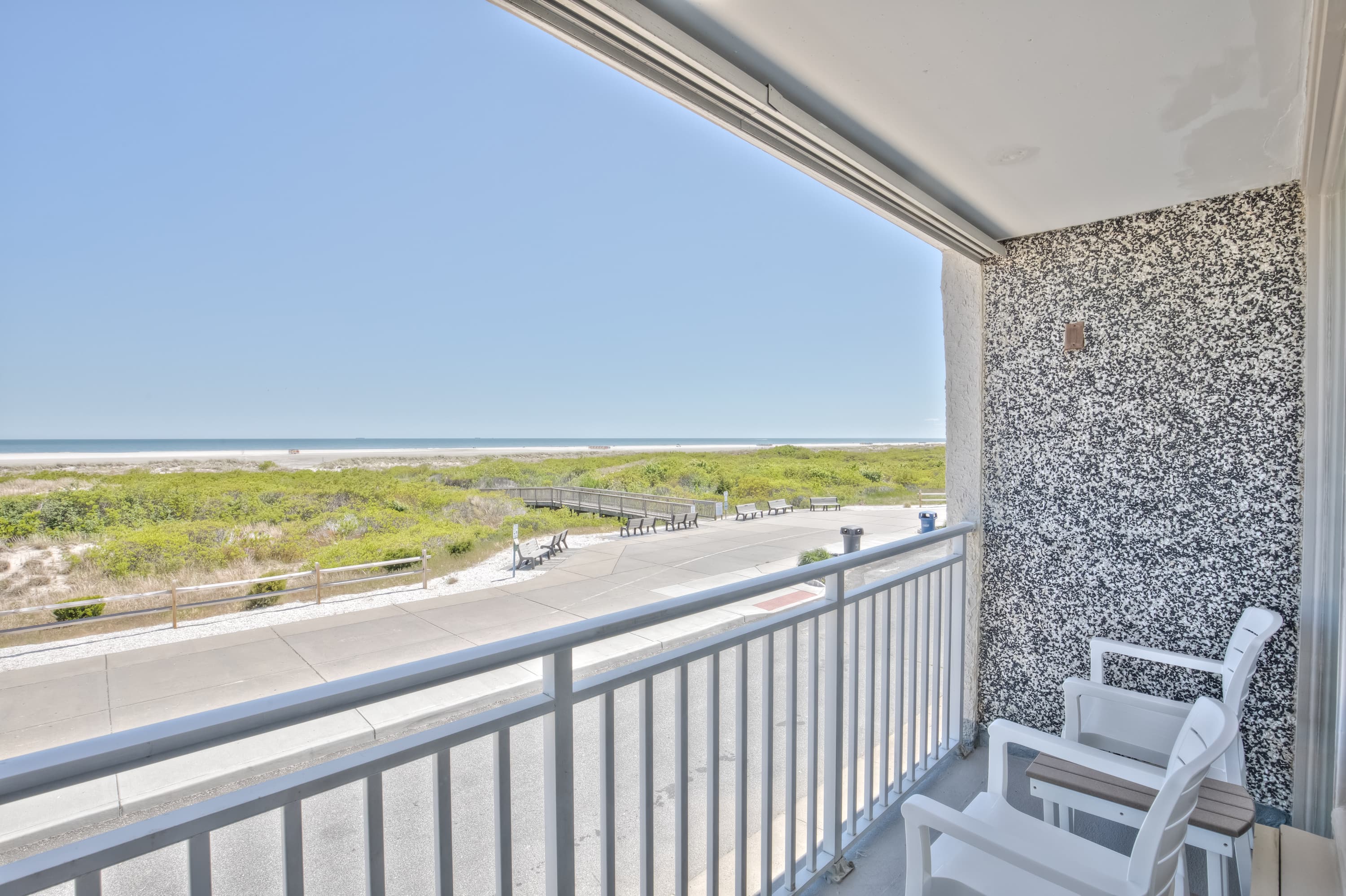 Private balcony directly faces the ocean and bike path